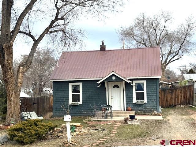 308 North Beech Street Cortez, CO 81321 - Photo 15 of 35 a view of a house with a yard covered in snow