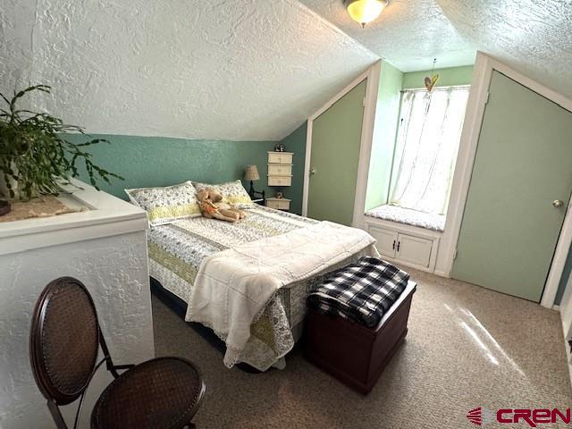 308 North Beech Street Cortez, CO 81321 - Photo 31 of 35 a bedroom with a bed and a window