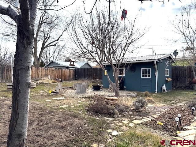 308 North Beech Street Cortez, CO 81321 - Photo 6 of 35 a view of a house with a yard covered in snow