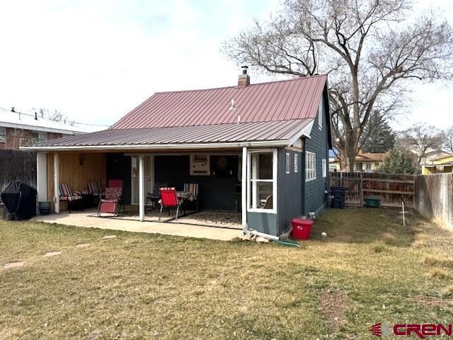 308 North Beech Street Cortez, CO 81321 - Photo 7 of 35 a view of a house with a patio and a yard