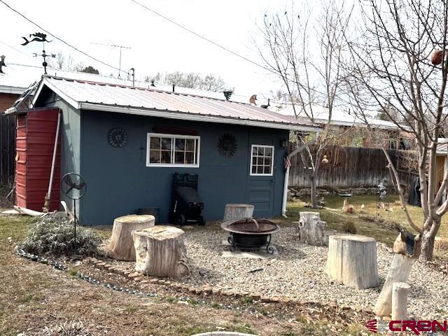308 North Beech Street Cortez, CO 81321 - Photo 10 of 35 a view of a outdoor space with a patio and fire pit