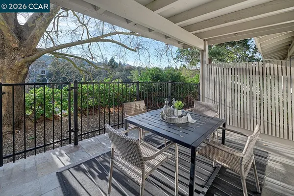 a view of a patio with a table chairs and a table