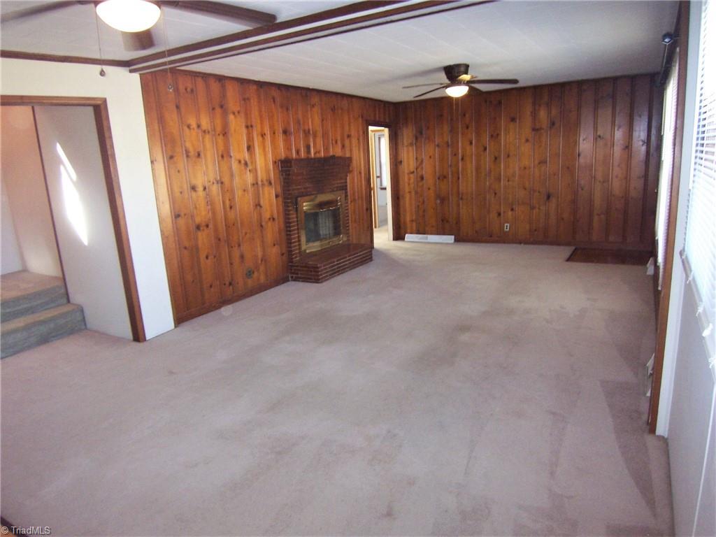 858 Cable Creek Road Asheboro, NC 27205 - Photo 2 of 26 Living room with brick fireplace