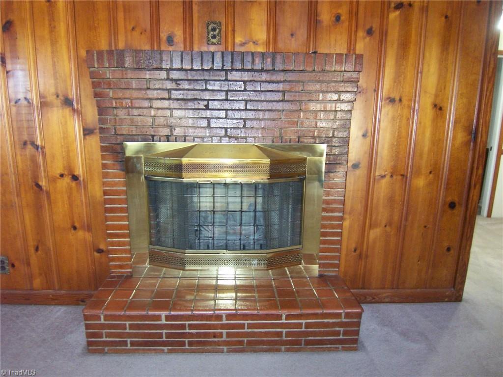 858 Cable Creek Road Asheboro, NC 27205 - Photo 6 of 26 Gas log fireplace with brick surround