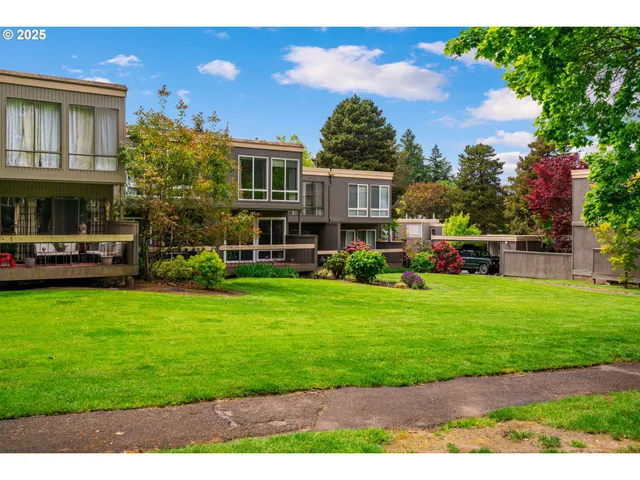 a front view of a house with a yard table and chairs