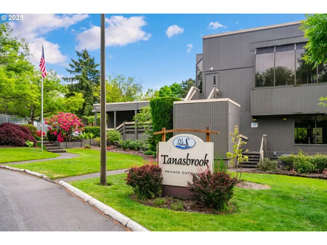 a view of a house with a yard and a garden