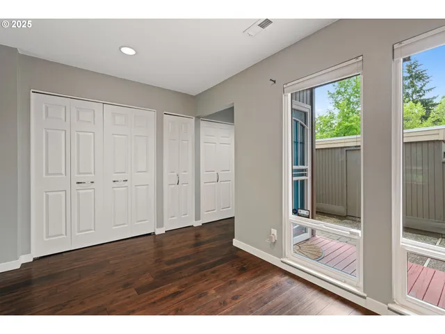 a view of front door with wooden floor