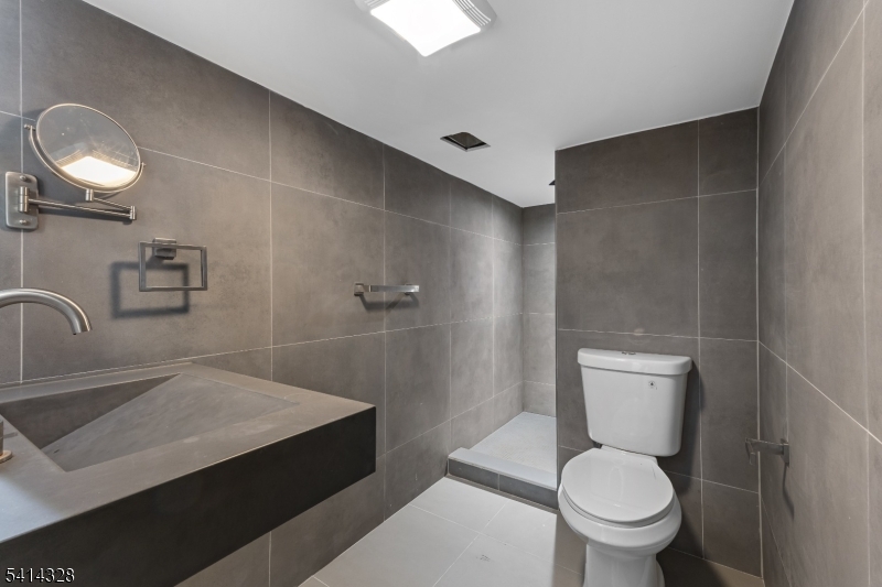 79 3rd Street Somerville, NJ 08876 - Photo 18 of 20 a bathroom with a toilet and a sink