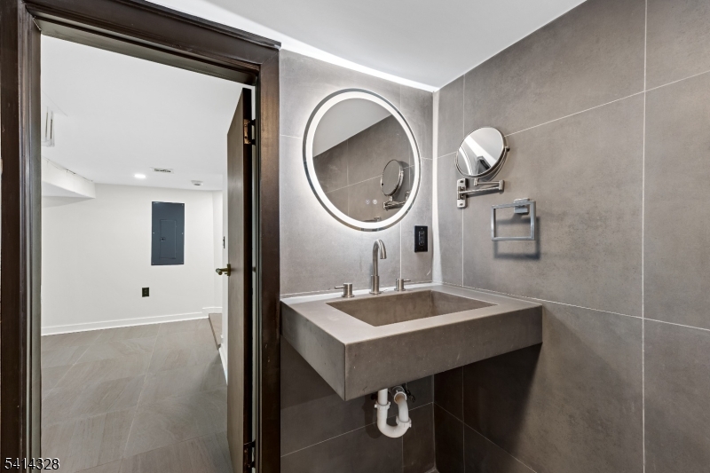 79 3rd Street Somerville, NJ 08876 - Photo 19 of 20 a bathroom with a sink and a mirror
