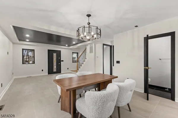 a view of a room with furniture and wooden floor