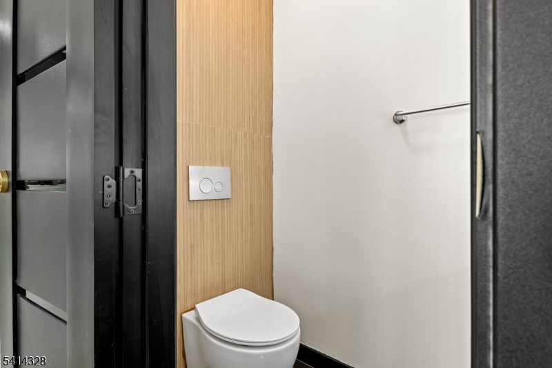 79 3rd Street Somerville, NJ 08876 - Photo 7 of 20 a white toilet sitting next to a shower