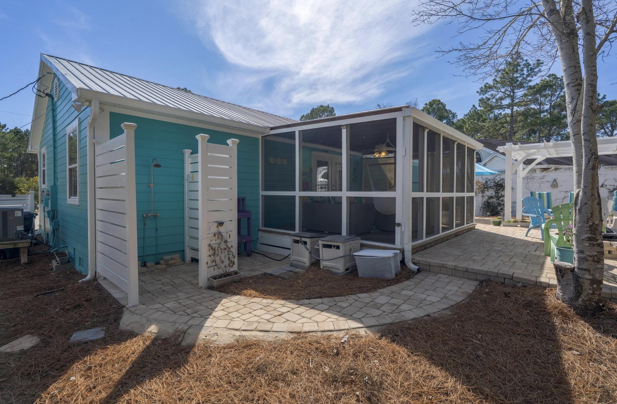 237 Monarch Drive Santa Rosa Beach, FL 32459 - Photo 21 of 30 a view of a house with a yard and wooden fence