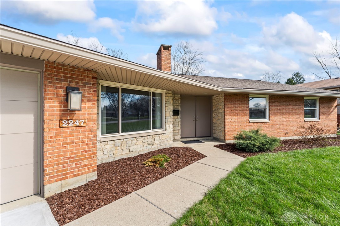 2247 East Whipp Road Dayton, OH 45440 - Photo 7 of 52 This charming residence features a classic brick exterior and an inviting entryway.
