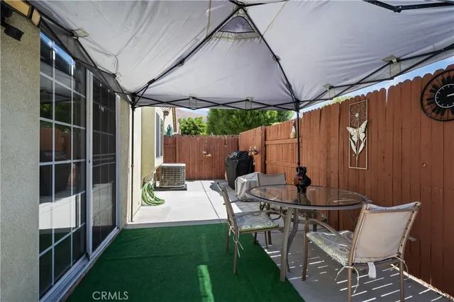 a building exterior with chair and table
