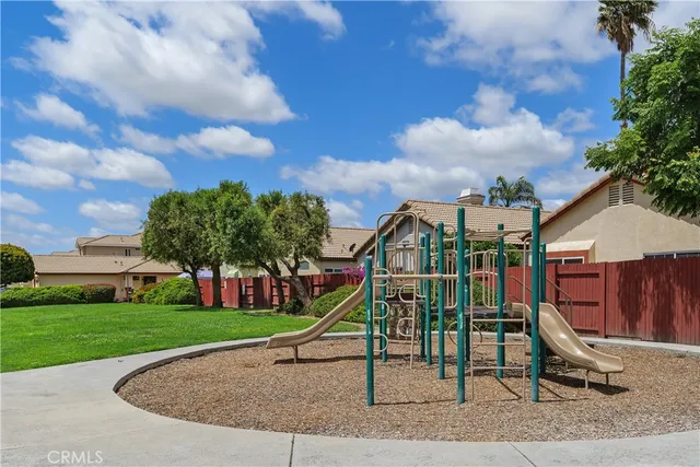 a front view of a house with a yard and a garage