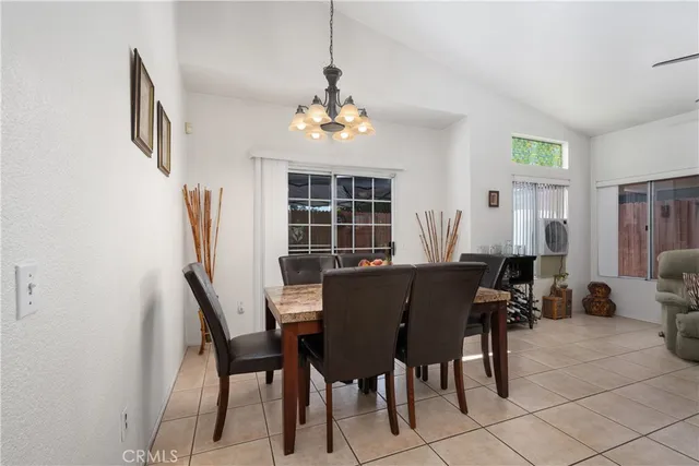 a view of a dining room with furniture and window