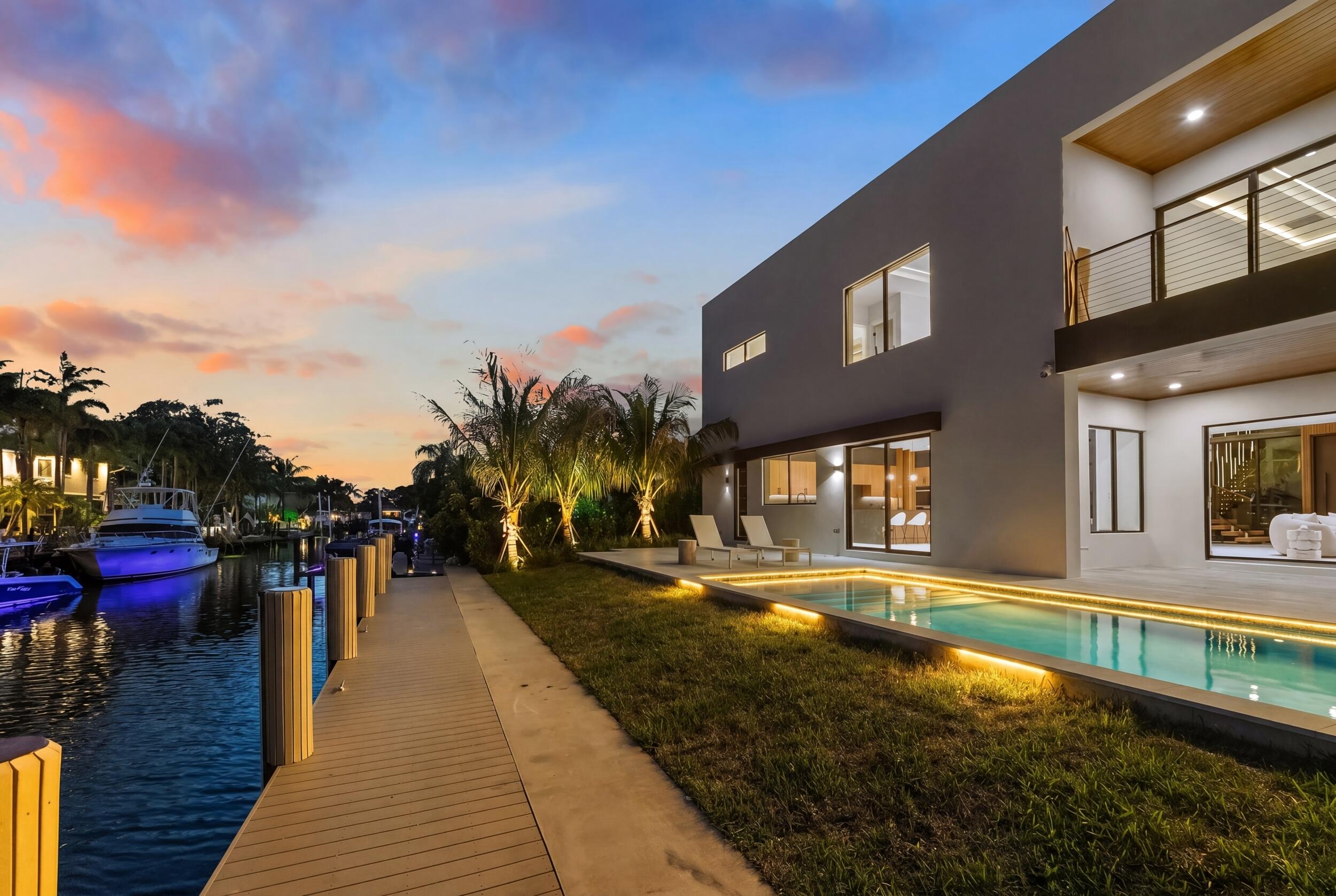 2360 Northeast 49th Street Lighthouse Point, FL 33064 - Photo 26 of 66 a view of a swimming pool with an outdoor seating