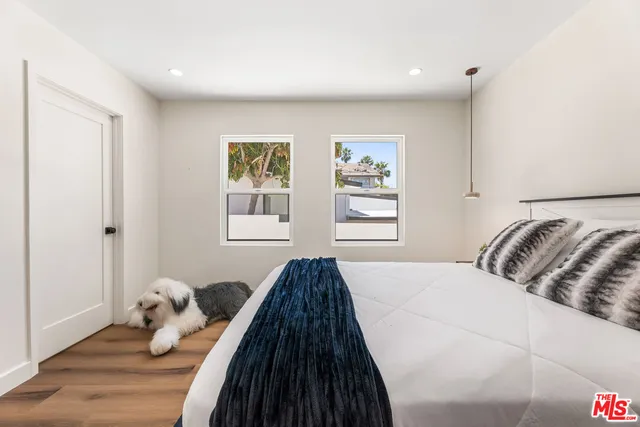 a bedroom with bed and window