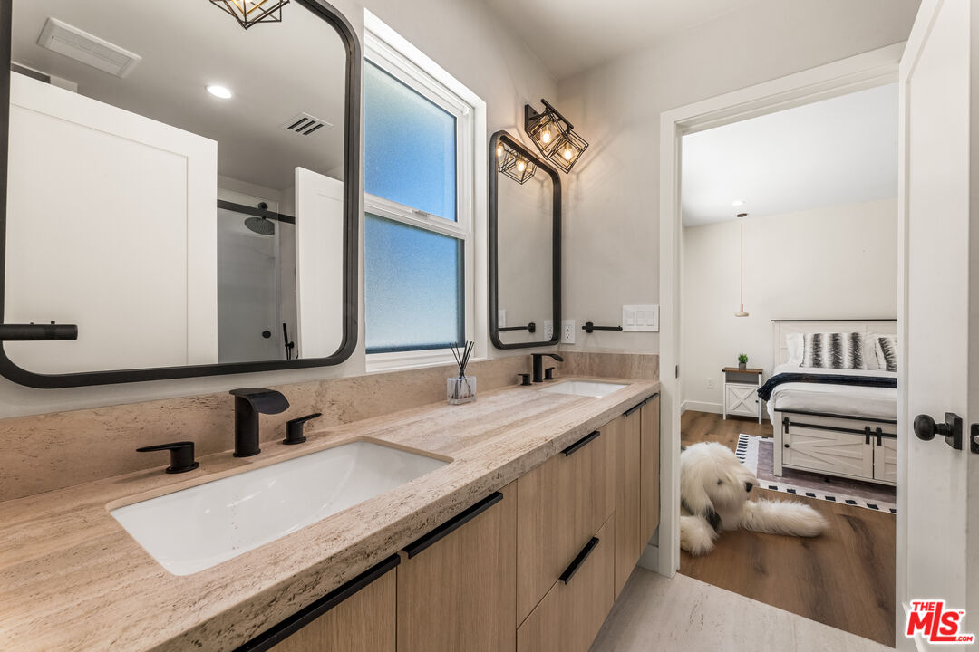 266 Mabery Road Santa Monica, CA 90402 - Photo 27 of 47 a bathroom with a sink double vanity and a mirror