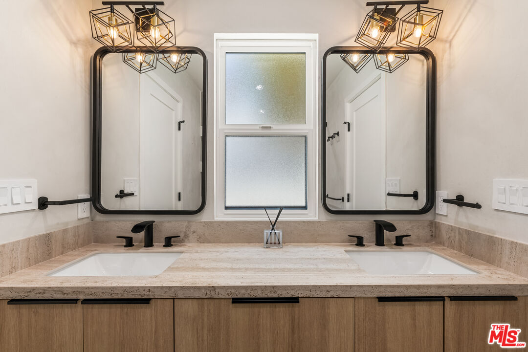 266 Mabery Road Santa Monica, CA 90402 - Photo 30 of 47 a bathroom with a granite countertop sink and a mirror
