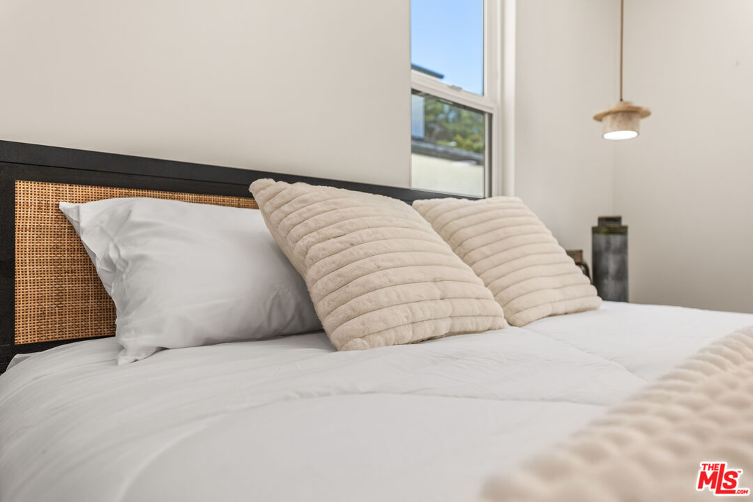 266 Mabery Road Santa Monica, CA 90402 - Photo 32 of 47 a bedroom with a bed and a painting on the wall