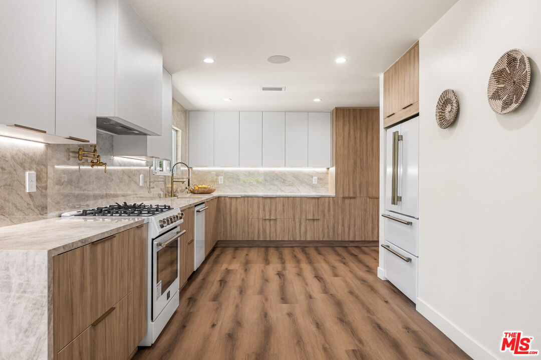 266 Mabery Road Santa Monica, CA 90402 - Photo 39 of 47 a kitchen with a refrigerator and a stove top oven