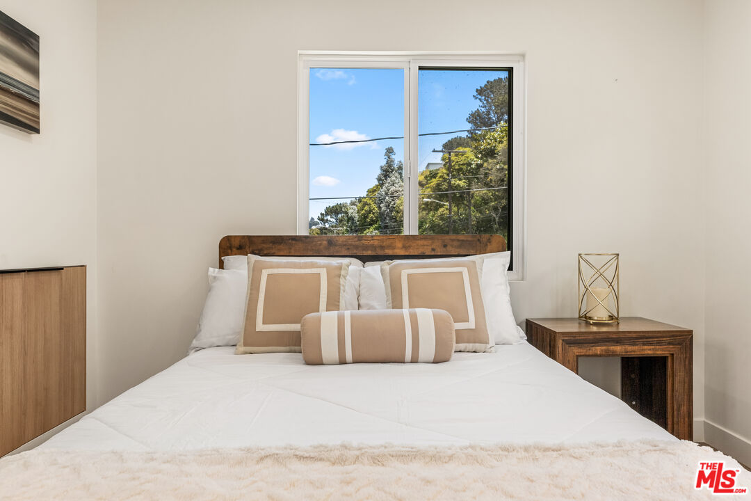 266 Mabery Road Santa Monica, CA 90402 - Photo 42 of 47 a large white bed sitting in a room next to a window