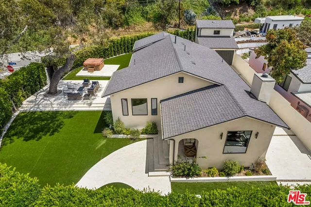 an aerial view of a house with a garden