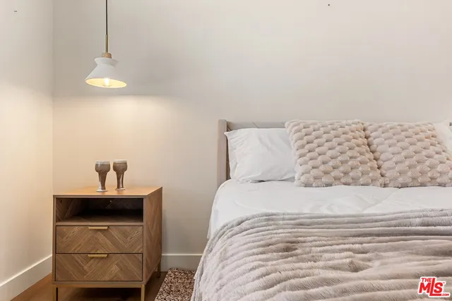 a bedroom with a bed and a sink