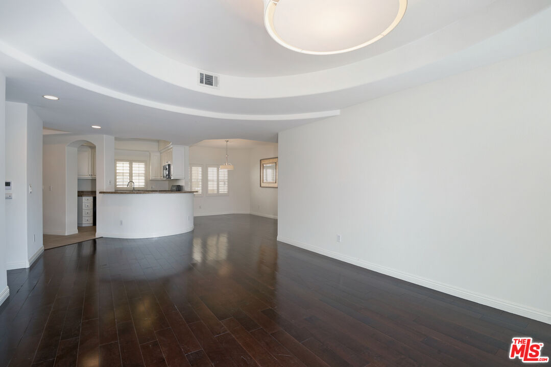 4400 Cartwright Avenue, Unit 201 Toluca Lake, CA 91602 - Photo 13 of 30 a view of kitchen and hall with wooden floor