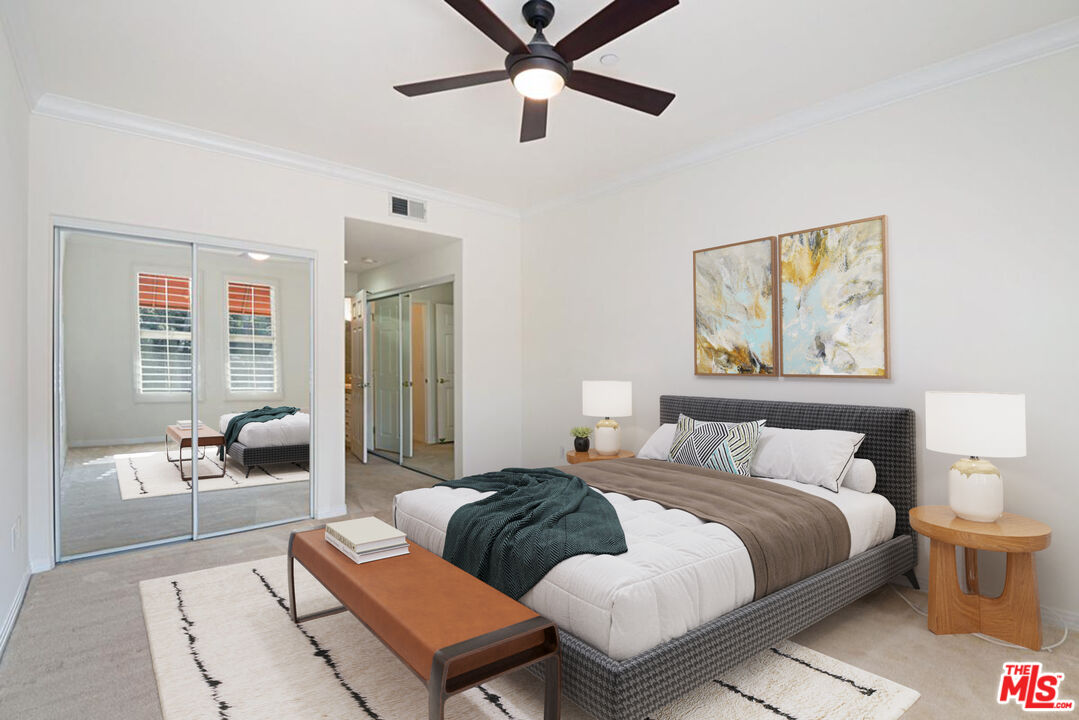 4400 Cartwright Avenue, Unit 201 Toluca Lake, CA 91602 - Photo 20 of 30 a bedroom with a bed couch and a window