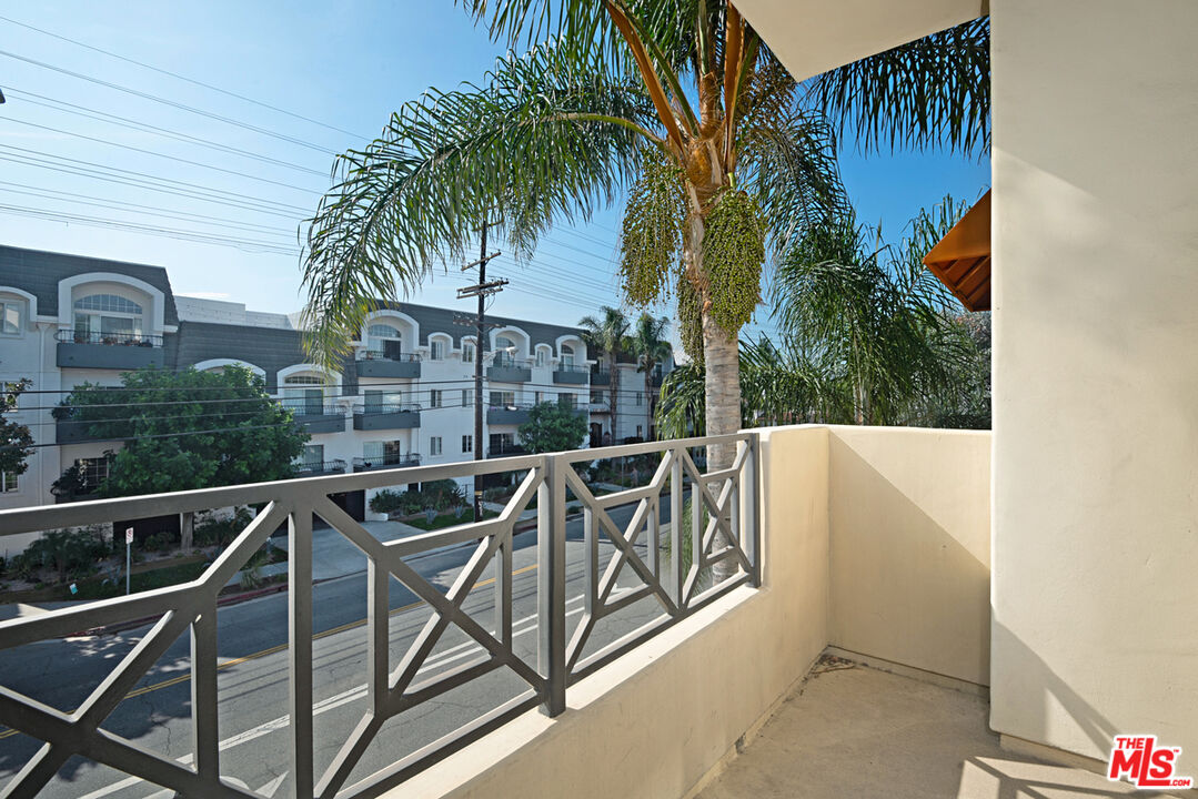 4400 Cartwright Avenue, Unit 201 Toluca Lake, CA 91602 - Photo 26 of 30 a view of a swimming pool with a patio