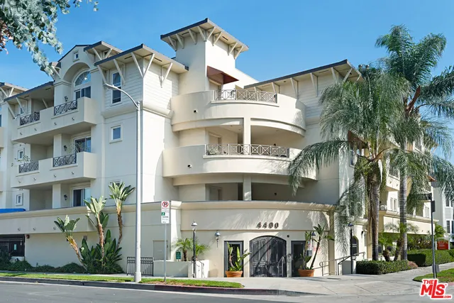 a front view of a building with garden