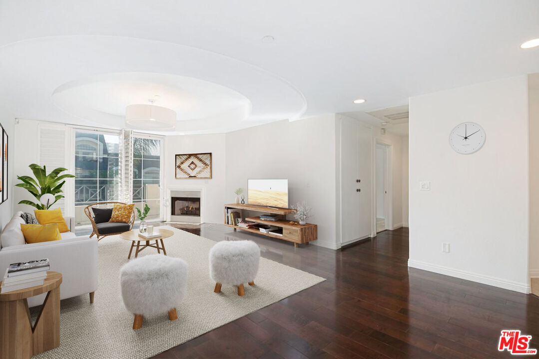 4400 Cartwright Avenue, Unit 201 Toluca Lake, CA 91602 - Photo 3 of 30 a living room with furniture and a flat screen tv