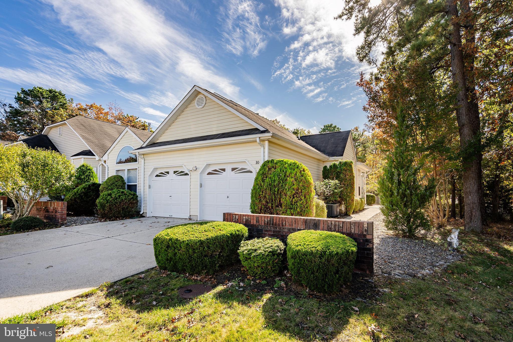 10 Hampton Road Manahawkin, NJ 08050 - Photo 1 of 36 a backyard of a house with lots of green space