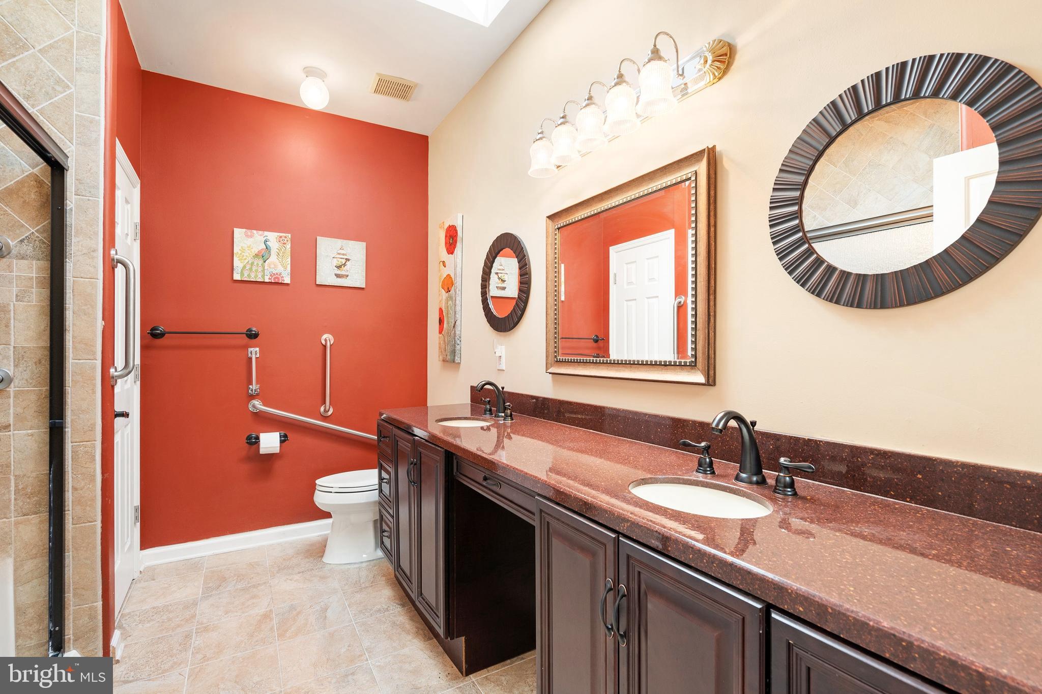 10 Hampton Road Manahawkin, NJ 08050 - Photo 18 of 36 a bathroom with a sink and a mirror