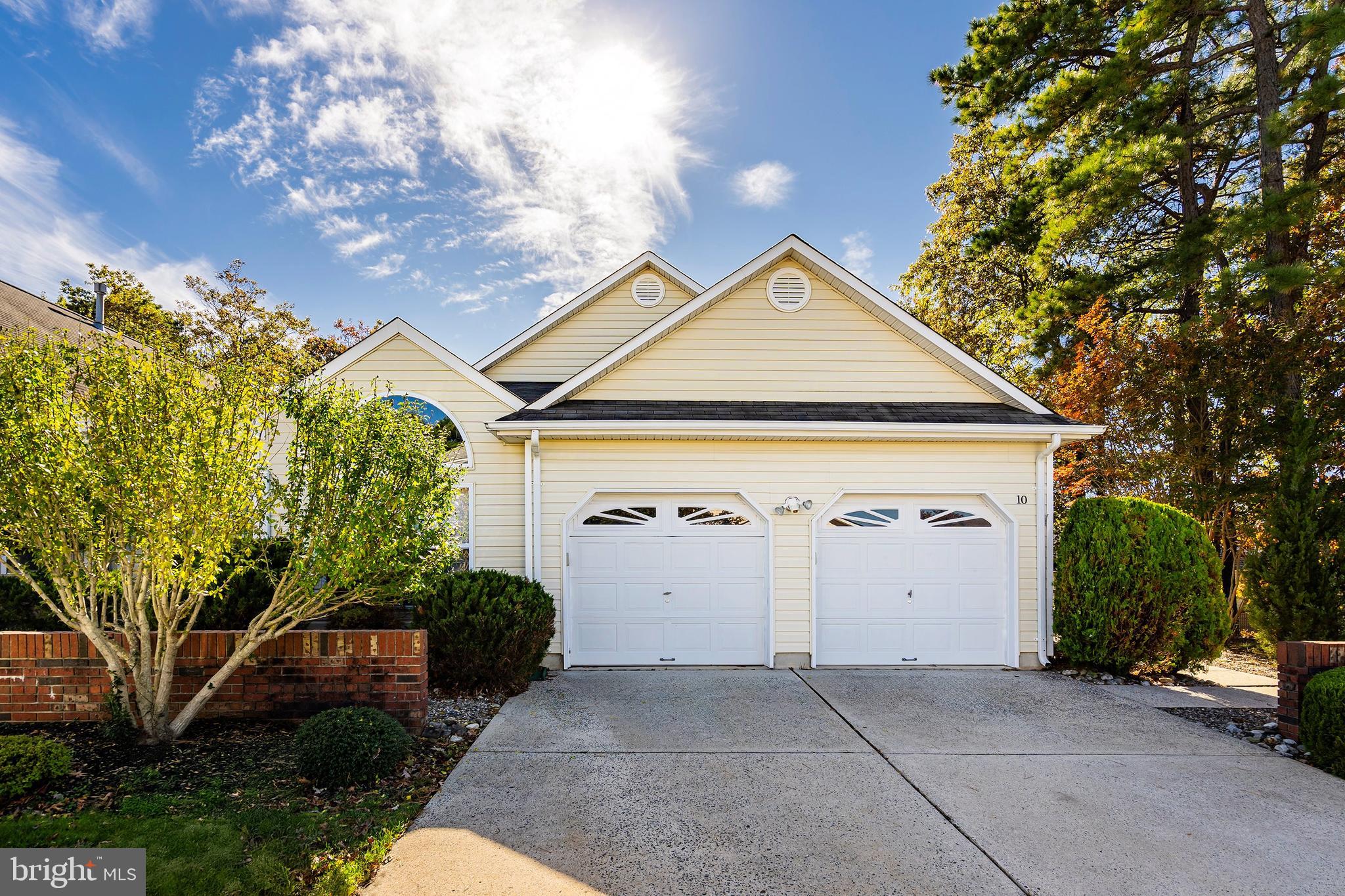 10 Hampton Road Manahawkin, NJ 08050 - Photo 2 of 36 a front view of a house with garden