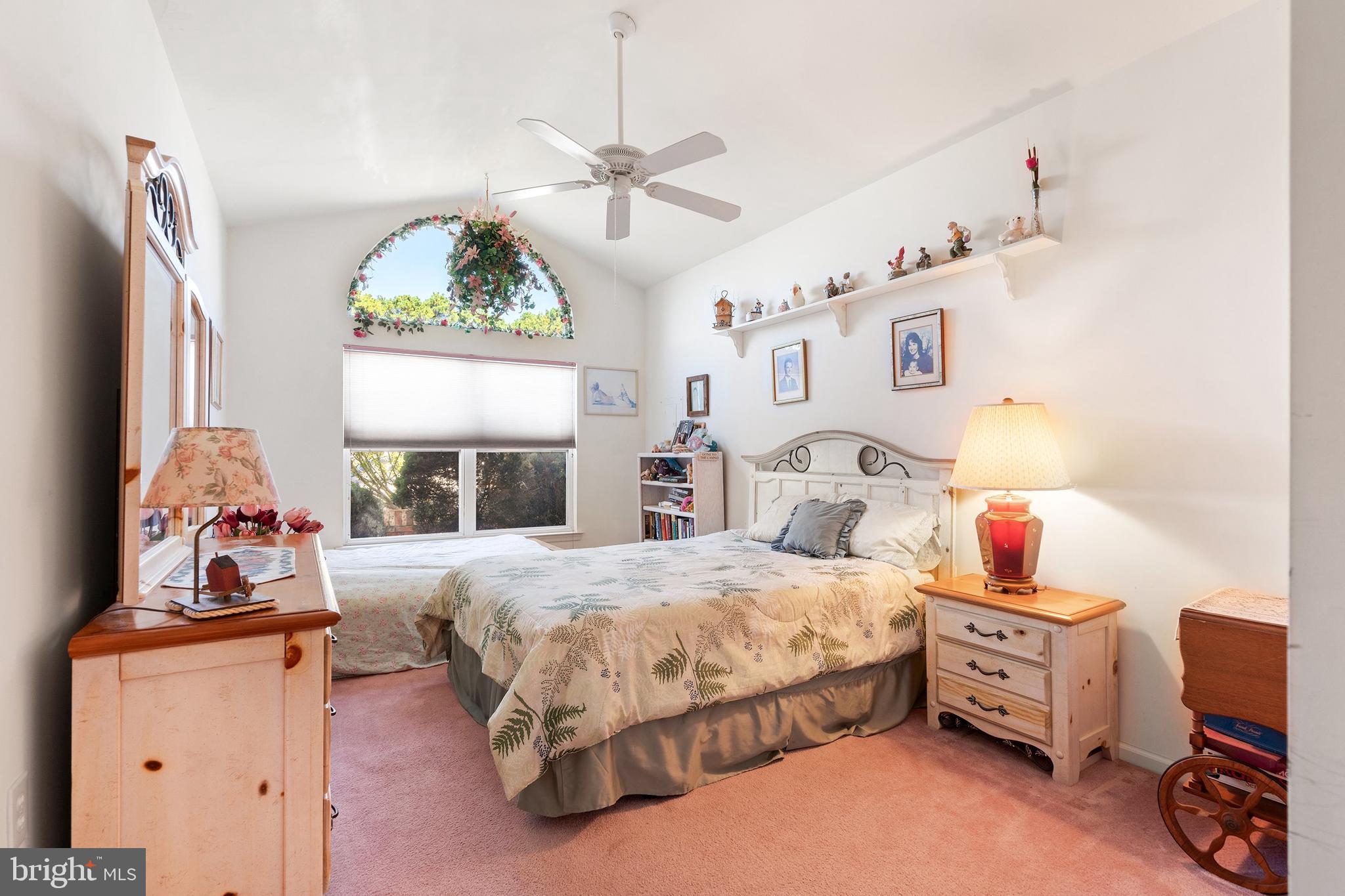 10 Hampton Road Manahawkin, NJ 08050 - Photo 22 of 36 a bedroom with a bed and a chandelier