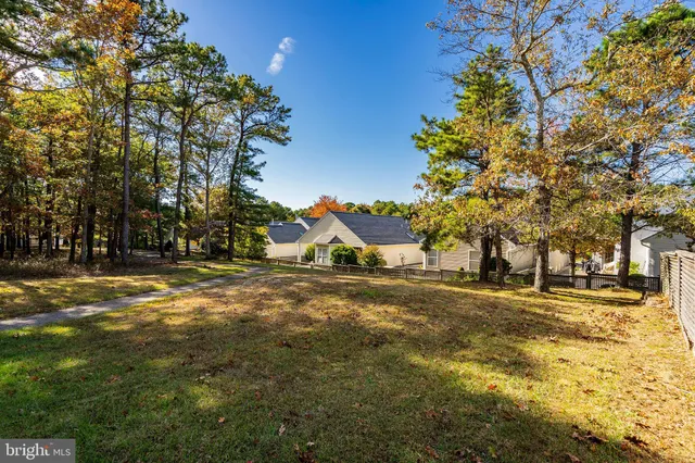 an aerial view of a house with a lake view