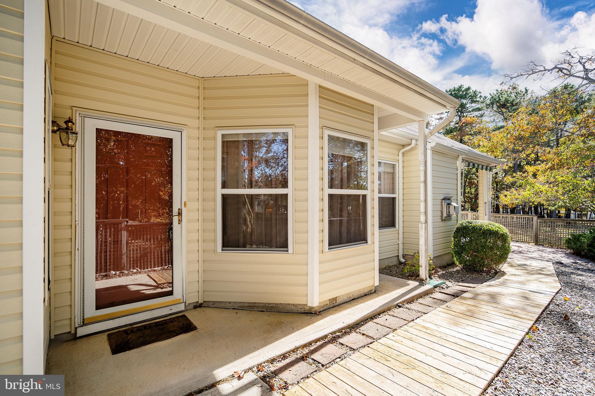 10 Hampton Road Manahawkin, NJ 08050 - Photo 3 of 36 a view of a entryway door front of house