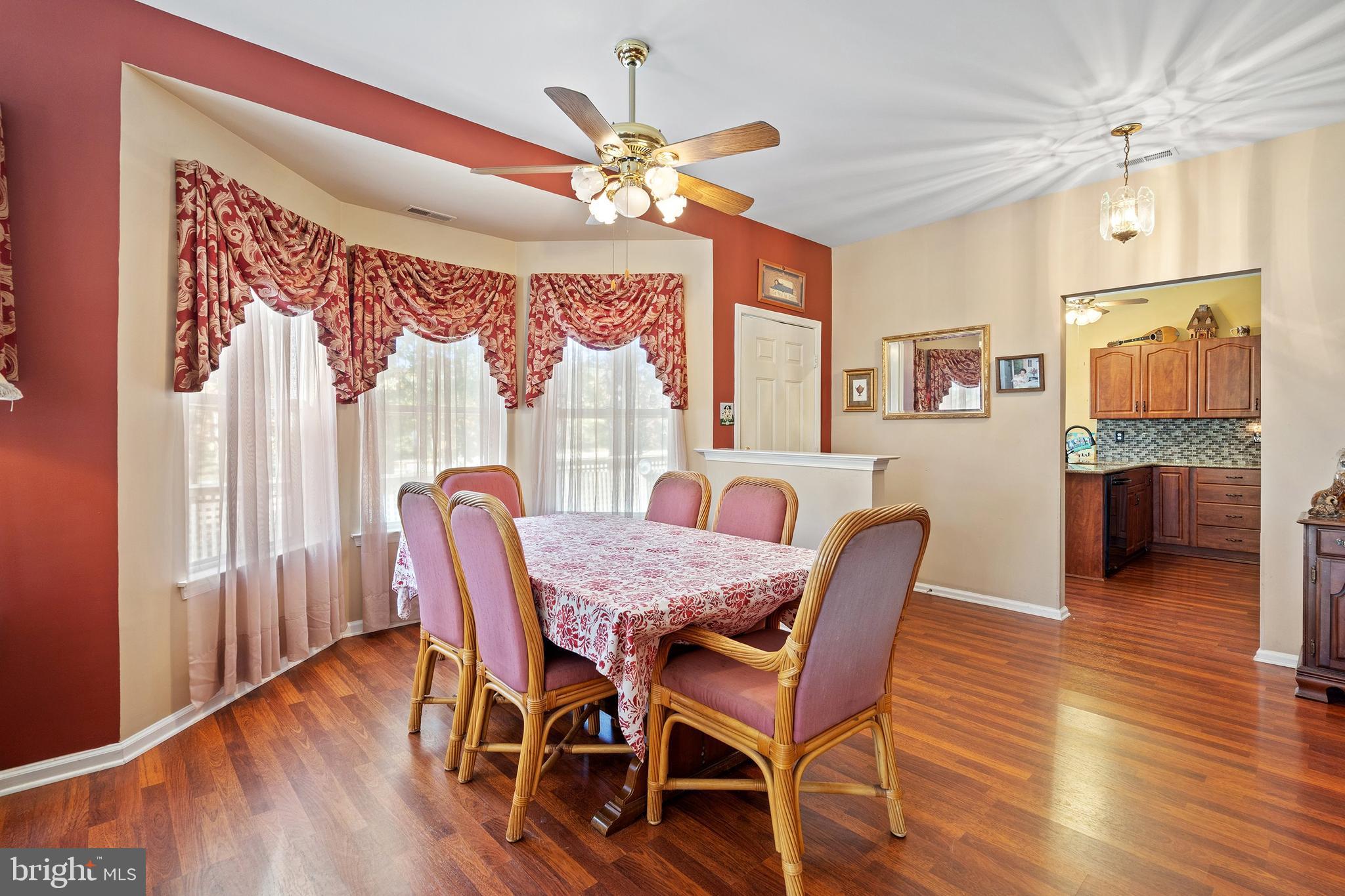 10 Hampton Road Manahawkin, NJ 08050 - Photo 6 of 36 a view of a dining room with furniture window and wooden floor