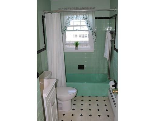 82 Edgewater Road Hull, MA 02045 - Photo 11 of 25 a bathroom with a sink a toilet and shower