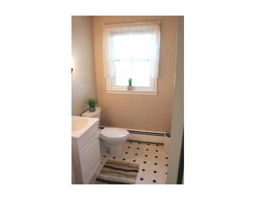 82 Edgewater Road Hull, MA 02045 - Photo 18 of 25 a bathroom with a toilet a sink a shower and a window