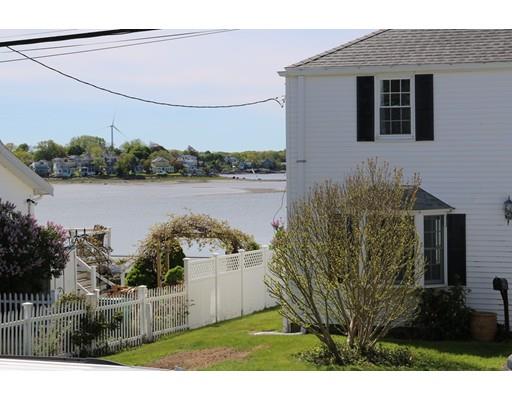 82 Edgewater Road Hull, MA 02045 - Photo 24 of 25 a front view of a house with a yard and lake view