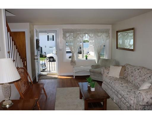 82 Edgewater Road Hull, MA 02045 - Photo 5 of 25 a living room with furniture and a large window