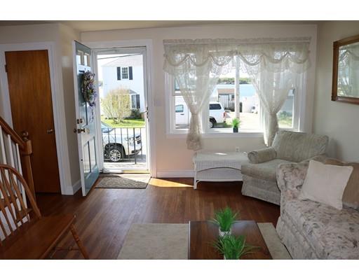 82 Edgewater Road Hull, MA 02045 - Photo 6 of 25 a living room with furniture and a large window