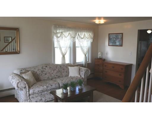 82 Edgewater Road Hull, MA 02045 - Photo 7 of 25 a living room with furniture and a large window