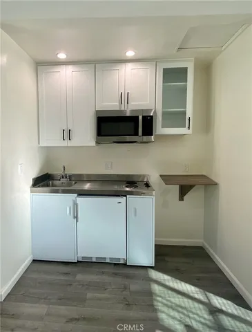 a bathroom with a toilet sink and shower