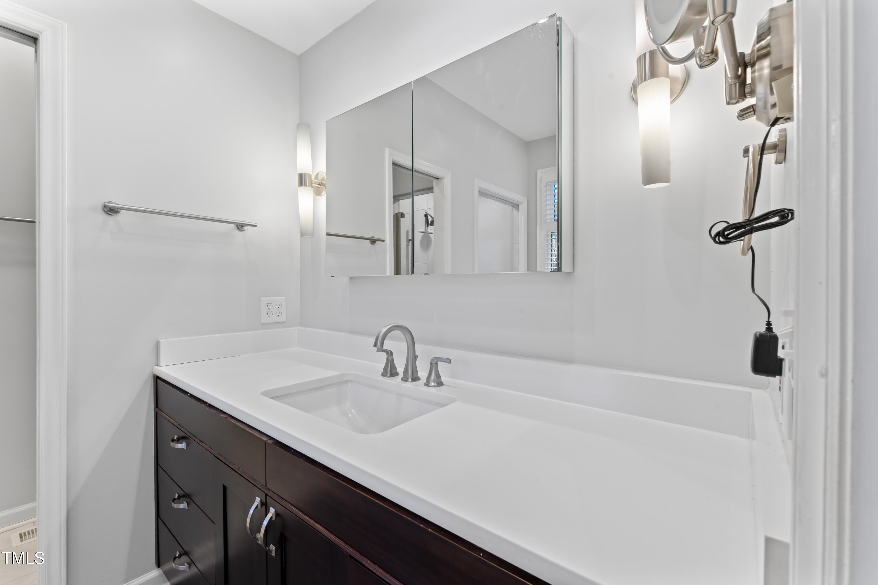 111 Legacy Lane Durham, NC 27713 - Photo 16 of 24 a bathroom with a sink and a mirror
