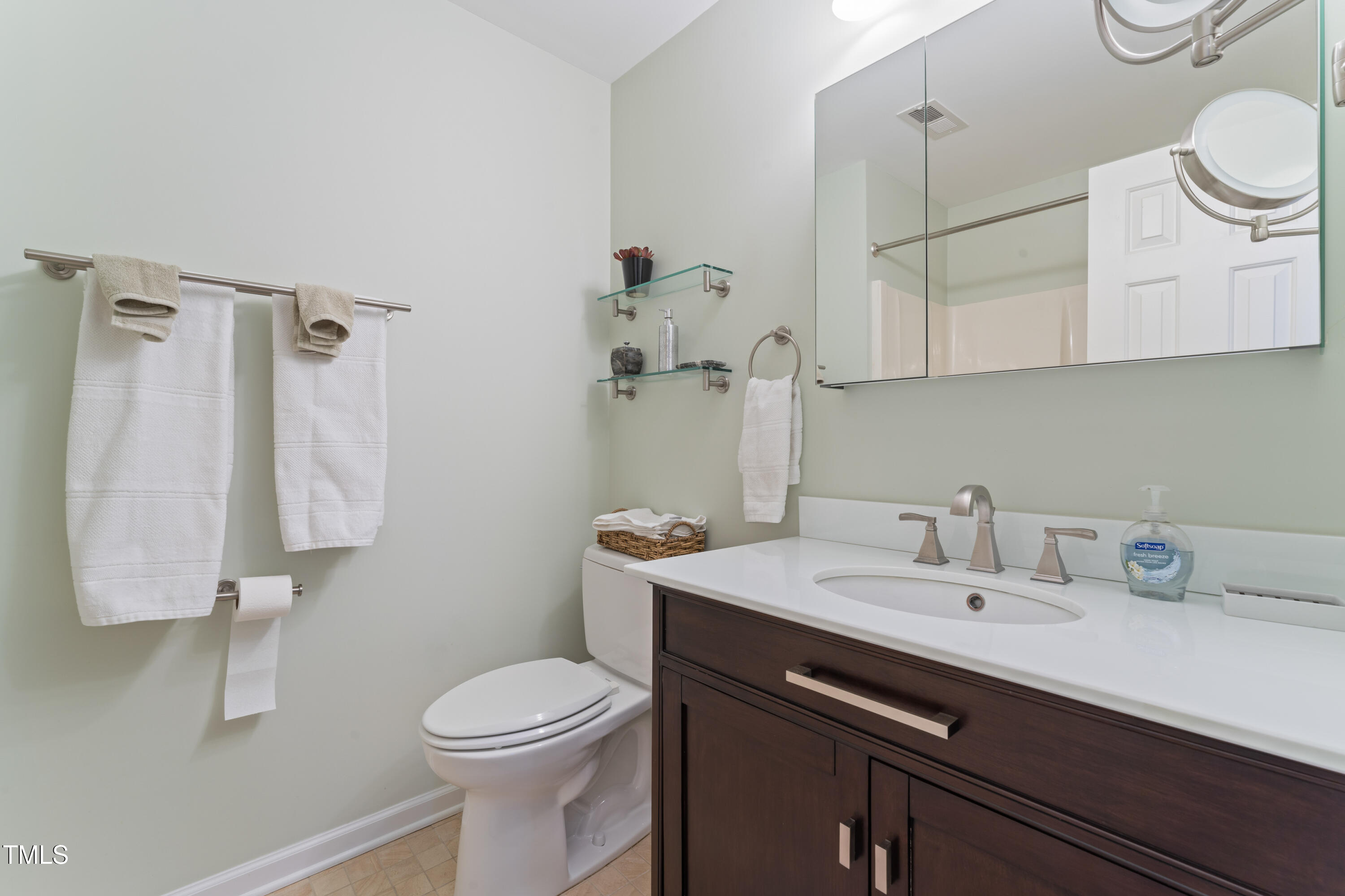 111 Legacy Lane Durham, NC 27713 - Photo 23 of 24 a bathroom with a sink a toilet and shower